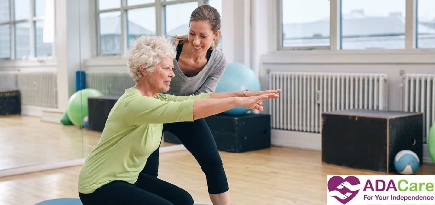elderly woman and trainer exercise